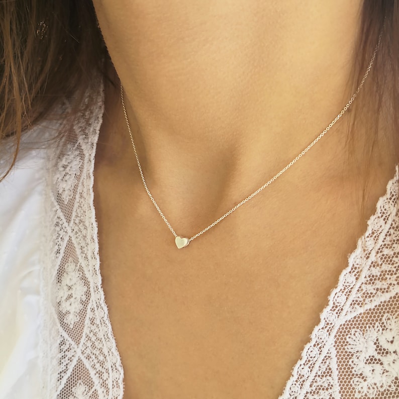 Minimalist heart Necklace with an extra tiny heart pendant
Sterling Silver 925   
The small heart necklace adds a sparkling shine to your style.
With a matt but shiny finish that makes is so unique!

Ideal for a birthday or Bridesmaid Gift