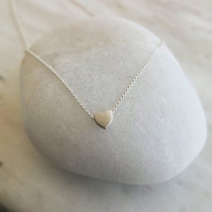 Minimalist heart Necklace with an extra tiny heart pendant
Sterling Silver 925   
The small heart necklace adds a sparkling shine to your style.
With a matt but shiny finish that makes is so unique!

Ideal for a birthday or Bridesmaid Gift