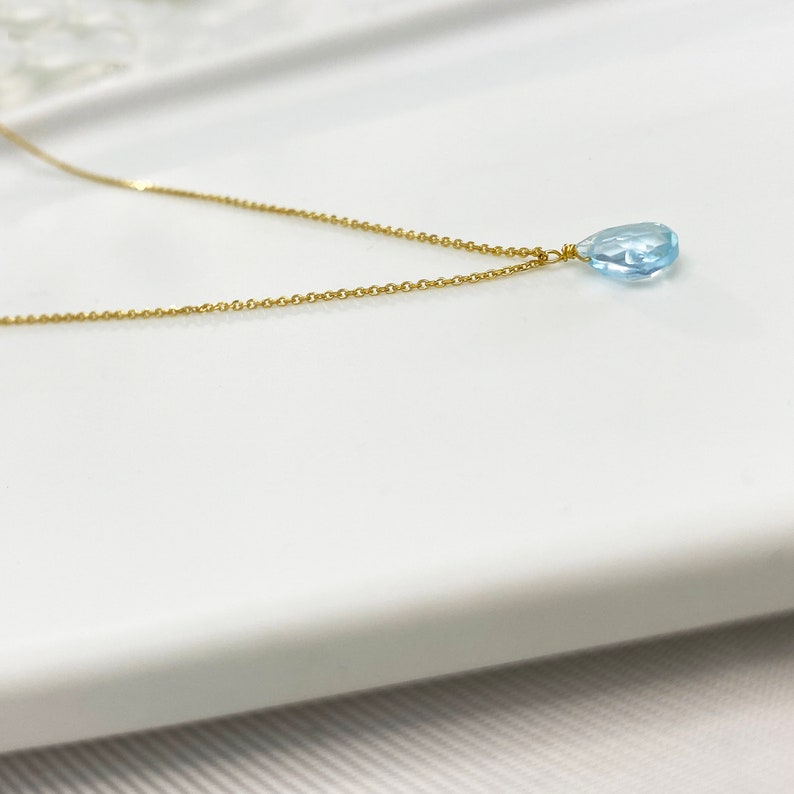 Raw Aquamarine Necklace or Aquamarine Choker.
Aquamarine Pendant. 
Dainty Aquamarine teardrop in a Light blue Stone Necklace.
 
925 Sterling silver, Aquamarine  
Great idea for a birthday gift, Pisces gift, or Aries Gift.