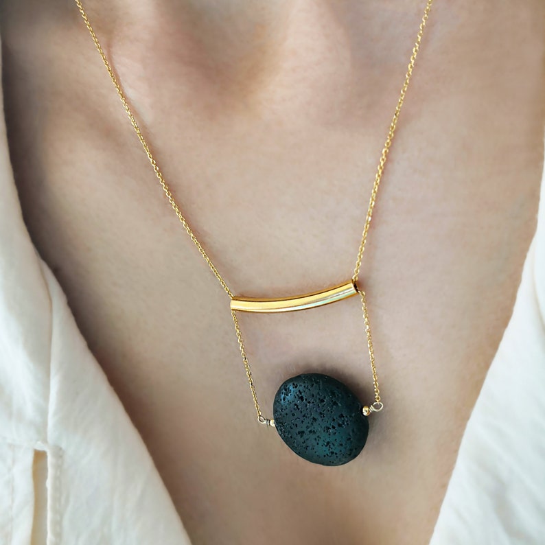 This real lava necklace is great Aromatherapy jewelry!

At the same time this 	Lava stone pendant, is a unique fidget necklace.
 
You will love this LAVA rock Diffuser Necklace.

Natural lava stone 
925 sterling silver that is yellow gold filled