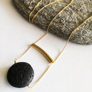 This real lava necklace is great Aromatherapy jewelry!

At the same time this 	Lava stone pendant, is a unique fidget necklace.
 
You will love this LAVA rock Diffuser Necklace.

Natural lava stone 
925 sterling silver that is yellow gold filled