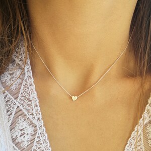 Minimalist heart Necklace with an extra tiny heart pendant
Sterling Silver 925   
The small heart necklace adds a sparkling shine to your style.
With a matt but shiny finish that makes is so unique!

Ideal for a birthday or Bridesmaid Gift