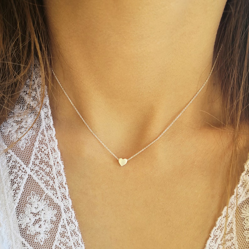 Minimalist heart Necklace with an extra tiny heart pendant
Sterling Silver 925   
The small heart necklace adds a sparkling shine to your style.
With a matt but shiny finish that makes is so unique!

Ideal for a birthday or Bridesmaid Gift