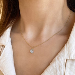 Raw Aquamarine Necklace or Aquamarine Choker.
Aquamarine Pendant. 
Dainty Aquamarine teardrop in a Light blue Stone Necklace.
 
925 Sterling silver, Aquamarine  
Great idea for a birthday gift, Pisces gift, or Aries Gift.