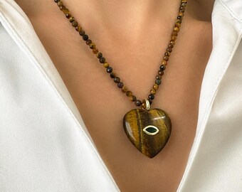 Tiger eye gemstone beaded necklace with a statement heart pendant.