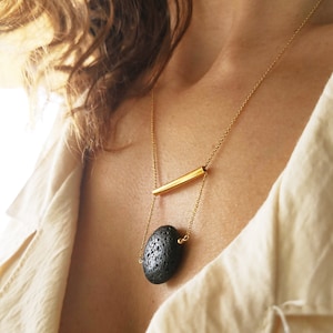 This real lava necklace is great Aromatherapy jewelry!

At the same time this 	Lava stone pendant, is a unique fidget necklace.
 
You will love this LAVA rock Diffuser Necklace.

Natural lava stone 
925 sterling silver that is yellow gold filled