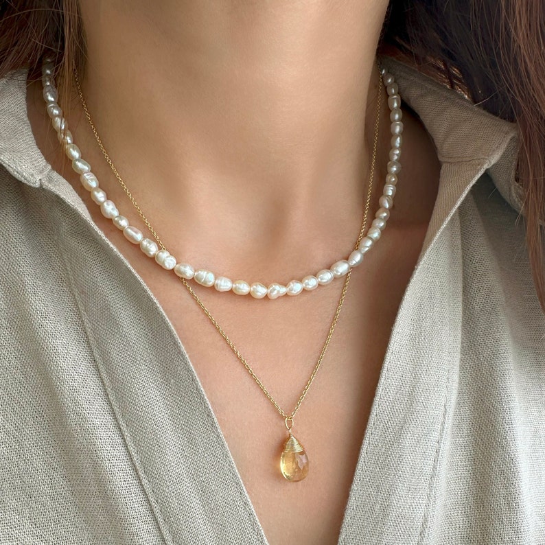 Stacking necklaces set with 
a Raw Citrine Necklace
a Seed pearl necklace.

This  Citrine crystal Necklace is a great idea for a Scorpio gift.

A dainty set with a Real Pearl Necklace and a  citrine Necklace
Handmade with 925 Sterling Silver and gems