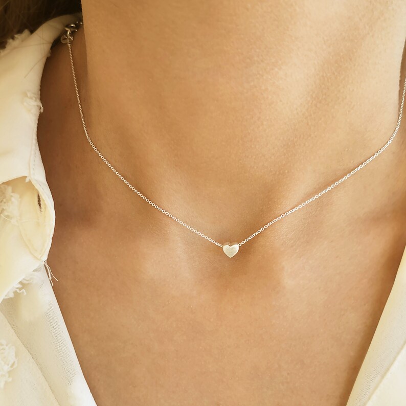 Minimalist heart Necklace with an extra tiny heart pendant
Sterling Silver 925   
The small heart necklace adds a sparkling shine to your style.
With a matt but shiny finish that makes is so unique!

Ideal for a birthday or Bridesmaid Gift