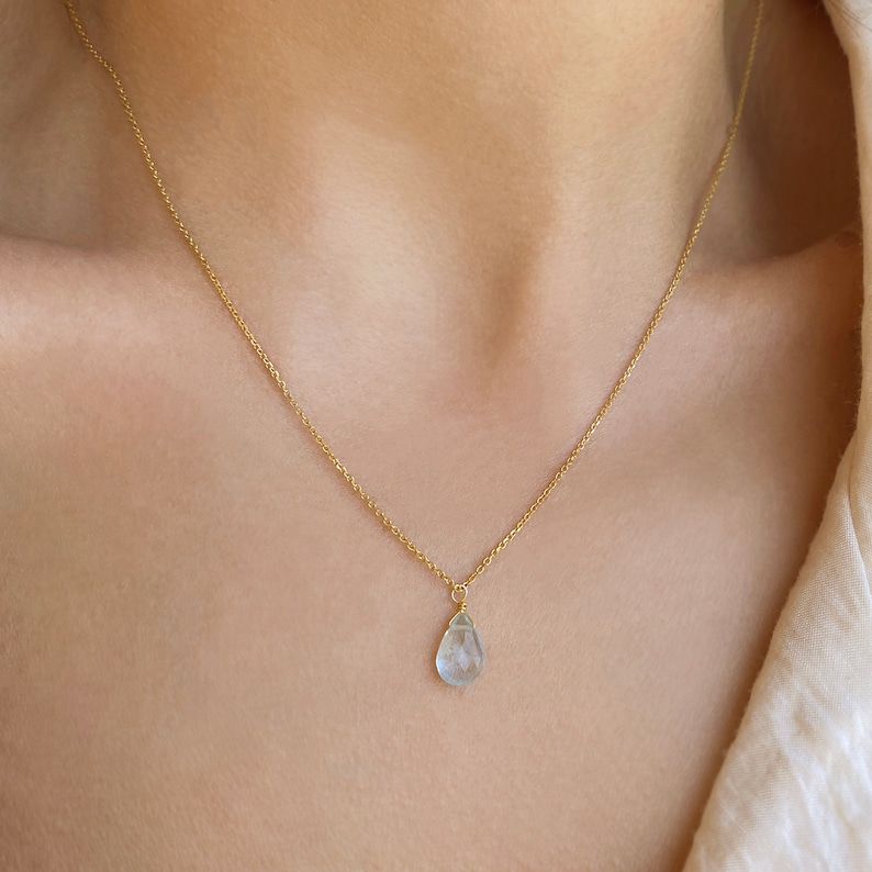 Raw Aquamarine Necklace or Aquamarine Choker.
Aquamarine Pendant. 
Dainty Aquamarine teardrop in a Light blue Stone Necklace.
 
925 Sterling silver, Aquamarine  
Great idea for a birthday gift, Pisces gift, or Aries Gift.