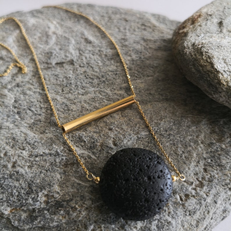 This real lava necklace is great Aromatherapy jewelry!

At the same time this 	Lava stone pendant, is a unique fidget necklace.
 
You will love this LAVA rock Diffuser Necklace.

Natural lava stone 
925 sterling silver that is yellow gold filled