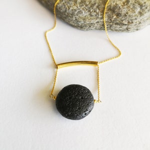 This real lava necklace is great Aromatherapy jewelry!

At the same time this 	Lava stone pendant, is a unique fidget necklace.
 
You will love this LAVA rock Diffuser Necklace.

Natural lava stone 
925 sterling silver that is yellow gold filled