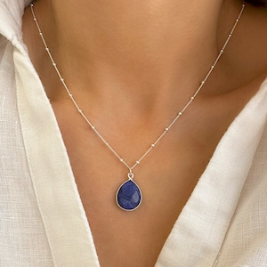 Genuine Raw Blue Sapphire Necklace 
A Good Vibes Necklace to offer as a September Birthstone Necklace.

A Real Blue Sapphire Teardrop pendant in a satellite chain necklace.

 High-Quality Solid 925 Sterling Silver

 Sterling Silver ∙ 24K Gold