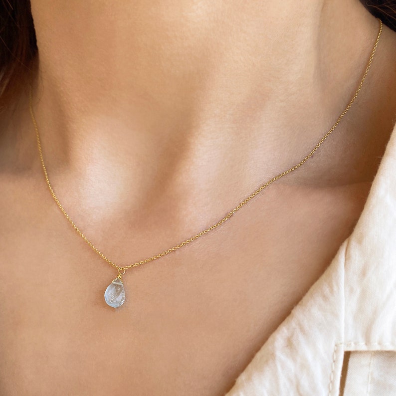 Raw Aquamarine Necklace or Aquamarine Choker.
Aquamarine Pendant. 
Dainty Aquamarine teardrop in a Light blue Stone Necklace.
 
925 Sterling silver, Aquamarine  
Great idea for a birthday gift, Pisces gift, or Aries Gift.