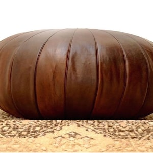 Embrace Moroccan Artistry: Handcrafted Round Leather Pouf - An Elegant Ottoman, Ideal for Weddings and as Thoughtful Gifts.