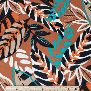 Dubbelborstad polyeten, havsskum/taupe/orange abstrakt tropiskt lövtryck med konjaksfärgad bas, tyg per halvmeter, meter, prov, 4-vägsstretch