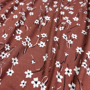 Double Brushed Poly, DBP Fabric, Ditsy White Floral on Brown Base