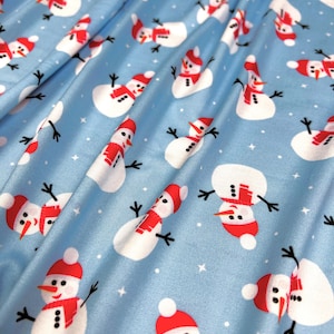 Double Brushed Poly, DBP Fabric, Snowman Print on Baby Blue Base,