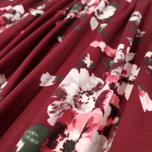 Double Brushed Poly, DBP Fabric, Pink/Green Floral with Maroon base.