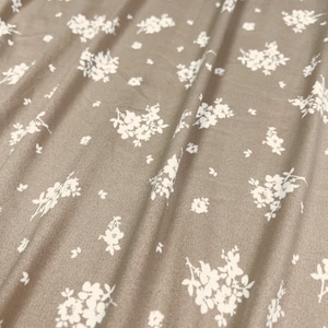 Double Brushed Poly, White Chunky Ditsy Floral Print w/ Tan Base, Poly Spandex Blend,
