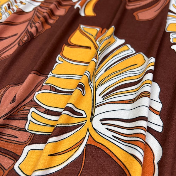 Double Brushed Poly, Rust/Yellow/White Tropical Leaf Print w/ Brown Base, Fabric by the 1/2 Yard, Yard, or Sample, 4 Way Stretch