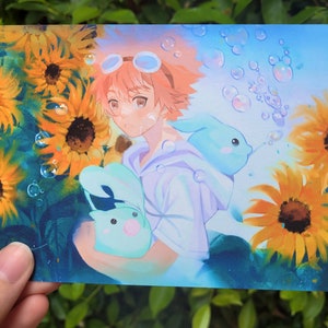 May include: A young person with pink hair and goggles stands in a field of sunflowers. They are holding two light blue plush toys shaped like bunnies. The background is a blue sky with white clouds and bubbles.