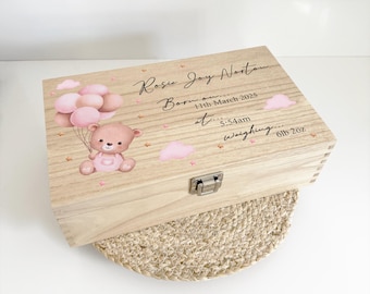 May include: A wooden keepsake box with a pink and brown teddy bear design. The box is personalized with the name "Rosie Joy Norton", birth date "11th March 2025", time "5:54am", and weight "6lb 2oz".