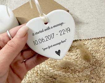 May include: White ceramic heart ornament with the text "it started with a message... 10.06.2017 - 22:19 "your first message here""