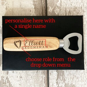 May include: A wooden bottle opener with a silver metal opener. The handle is engraved with the text "Elliott GROOMSMAN".