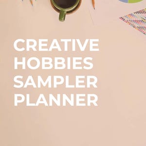 May include: Overhead shot of a workspace with pencils, a green mug of coffee, and a color wheel. The text "CREATIVE HOBBIES SAMPLER PLANNER" is displayed in large white letters. The background is a light peach color.