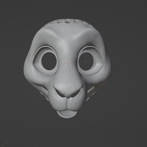 May include: A 3D-rendered, gray lion head with large, round eye sockets and a small nose. The lion's head has a smooth, matte finish and is set against a gray background. The top of the head features several small holes.