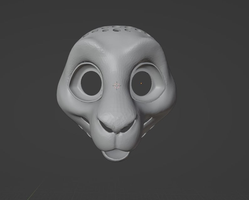 May include: A 3D-rendered, gray lion head with large, round eye sockets and a small nose. The lion's head has a smooth, matte finish and is set against a gray background. The top of the head features several small holes.
