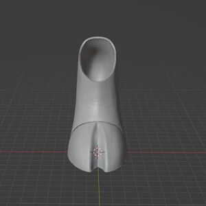 May include: A 3D-rendered, light gray object resembling a high-heeled shoe. The shoe has a rounded toe and a cylindrical heel. The background is a dark gray grid.