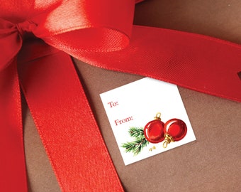 May include: A white gift tag with red and green Christmas ornaments and the words "To:" and "From:" printed on it.