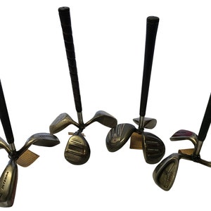 May include: Four golf club sets, each featuring a black grip and a metal shaft connected to a base of three club heads. The club heads are silver and dark grey, with some marked with the number 7 and the brand name Integra in black lettering.