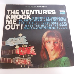 May include: Vintage vinyl record album cover for "The Ventures - Knock Me Out!" featuring a woman with blonde hair and a green shirt. The cover includes the album title, song titles, and images of guitars.