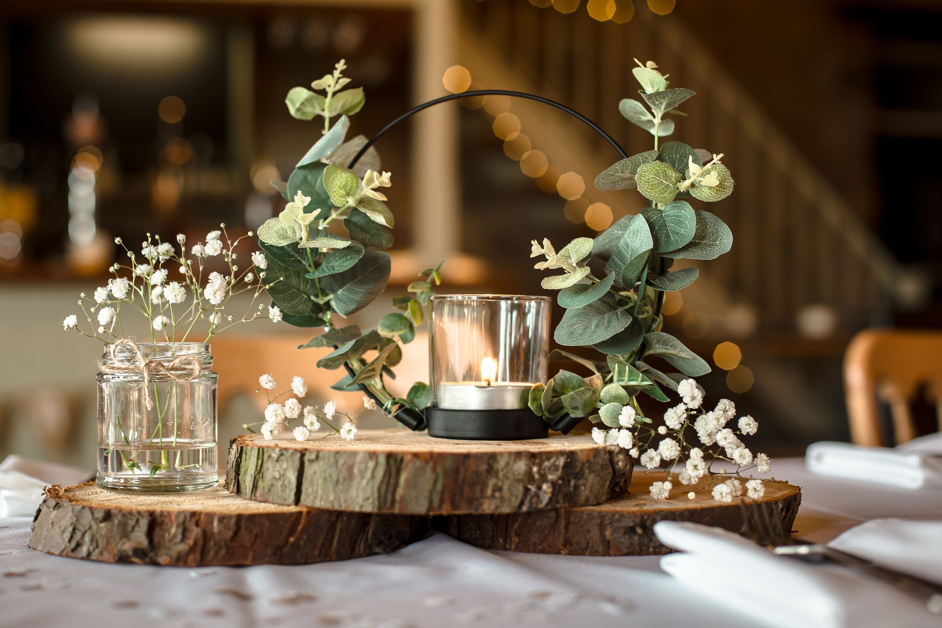 Birch Wood Centerpieces with Hydrangeas and Greenery and Wood Slab Table  Numbers