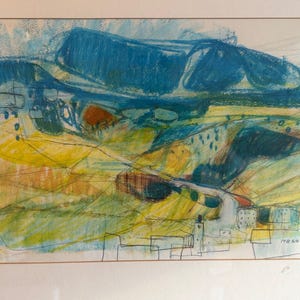 May include: A framed landscape drawing featuring bold blue mountain shapes above yellow and green fields. The foreground includes thin black ink outlines of buildings and structures, with the text MB 60 visible in the bottom right corner.