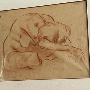 May include: A brown and white pencil drawing of a nude figure sitting with their head down. The drawing is signed "P. Vale. Di. Paris 1928" in the bottom right corner.