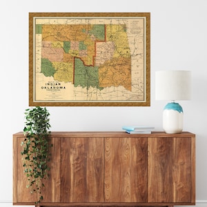 May include: A vintage map of the Indian Territory of Oklahoma, showing the different tribal lands and reservations. The map is printed in brown, green, and yellow colors and includes a key with the names of the tribes.
