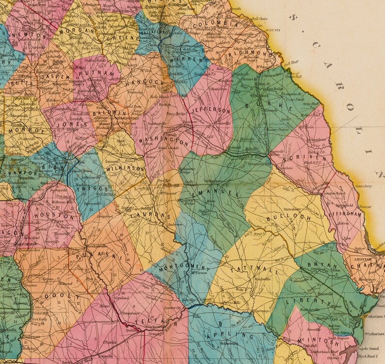 May include: A vintage map of Georgia, USA, showing the counties and their names. The map is colour-coded with different shades of pink, yellow, green, and blue. The map is dated 1860.