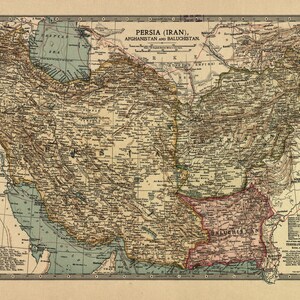 May include: A vintage map of Persia (Iran), Afghanistan, and Baluchistan. The map is printed on a cream-colored paper with brown, green, and blue ink. The map shows the borders of the countries, major cities, and geographical features.