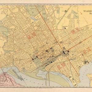 May include: A vintage map of Washington, D.C. with a beige background and red and black lines showing streets and waterways. The map includes the Potomac River, the Anacostia River, and Rock Creek Park. The map is titled "WASHINGTON D.C."