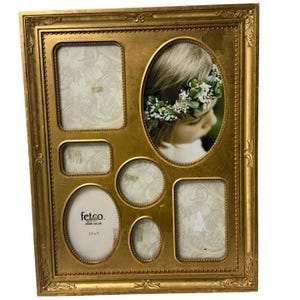 May include: A gold-colored multi-opening picture frame with an ornate, beaded border. The frame features one large oval opening, two rectangular openings, and two smaller oval openings. One opening contains a photo of a person wearing a floral crown.