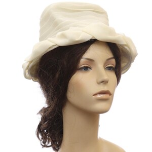 Vintage 1960s Cream Bow Cloche Hat Sheer Layered Brim Formal Church Turn every entrance into a vintage moment with this elegant  main image 2
