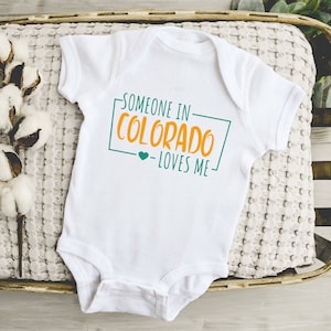Someone In Colorado Loves Me Onesie®, Colorado Baby Onesie®, Loved Baby Onesie®, Long Distance Baby Bodysuit®, State Baby Baby Bodysuit®