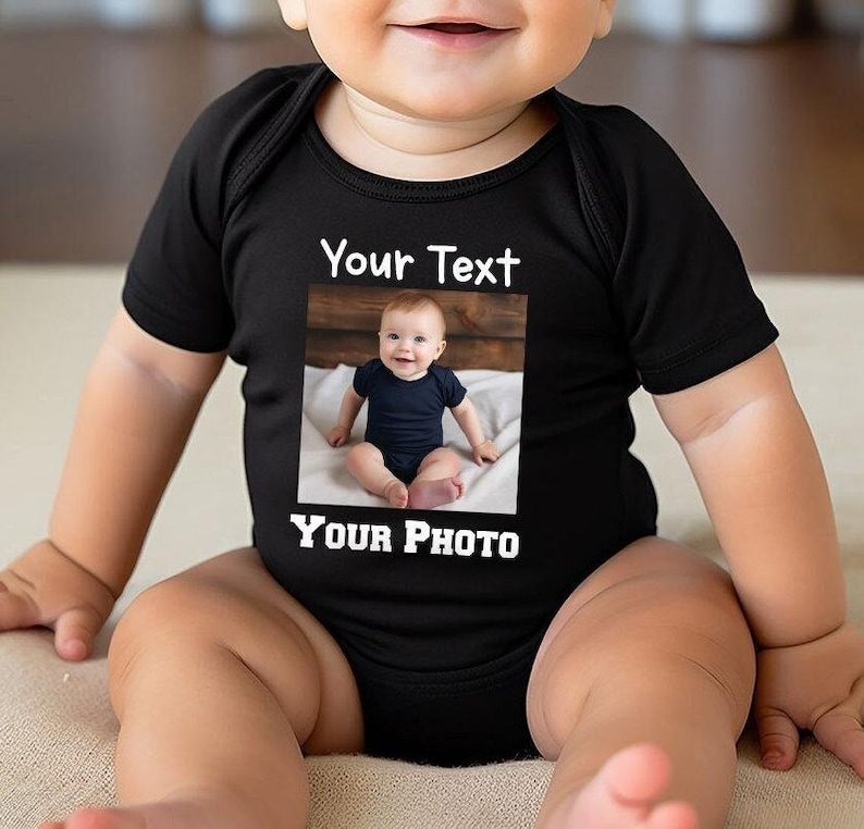 a baby sitting on top of a bed wearing a shirt