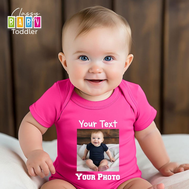 a baby sitting on a bed wearing a pink shirt