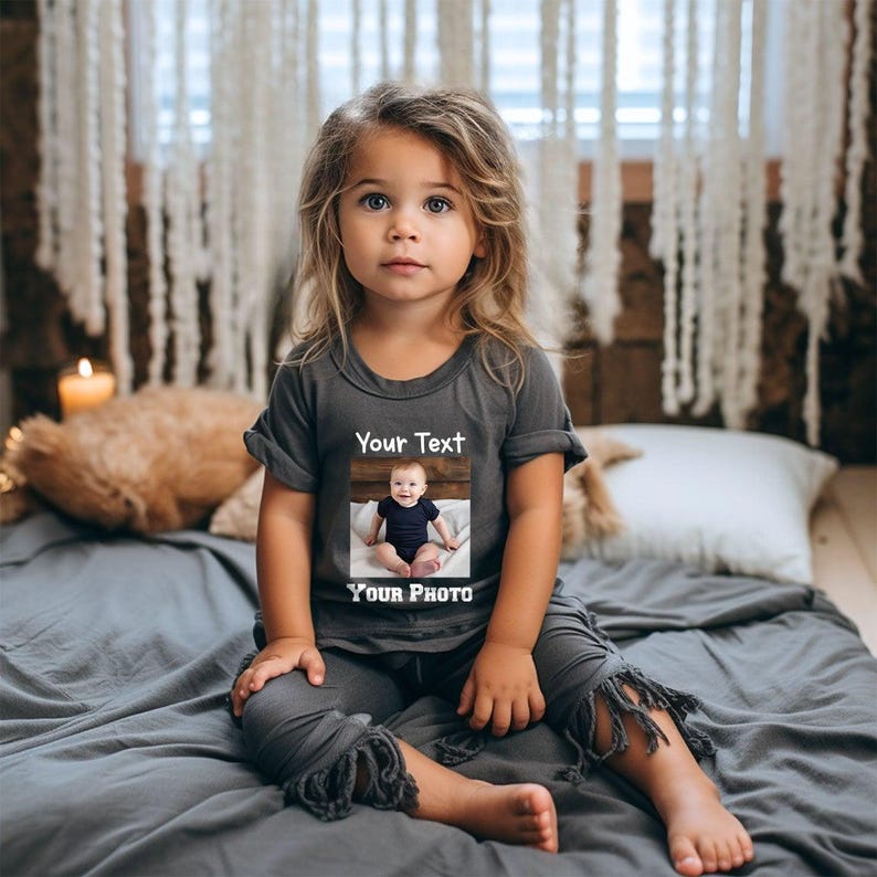 a little girl that is sitting on a bed