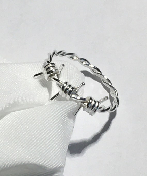 Silver barbed wire ring outlet