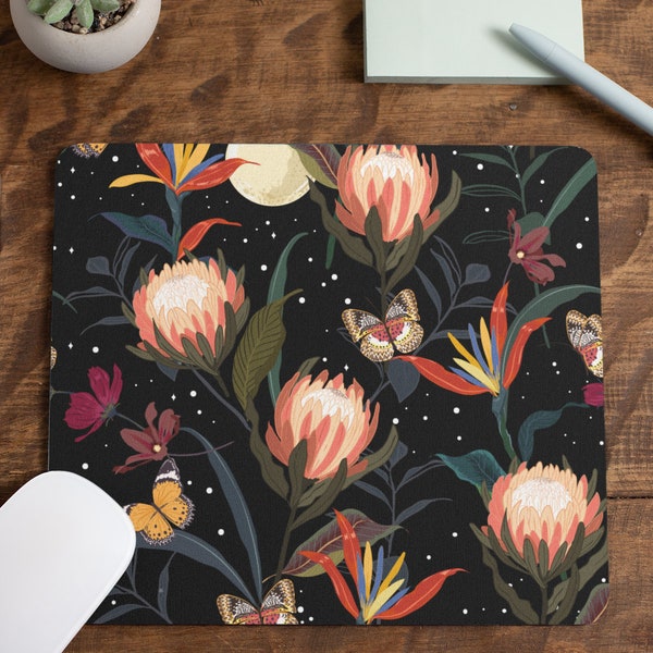 May include: A black mouse pad with a floral pattern featuring pink, orange, and yellow flowers, green leaves, and butterflies on a black background. The pattern is repeated throughout the mouse pad.